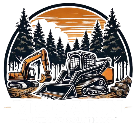 Construction equipment in a forest setting, with an excavator and skid steer, beneath an orange sunset.