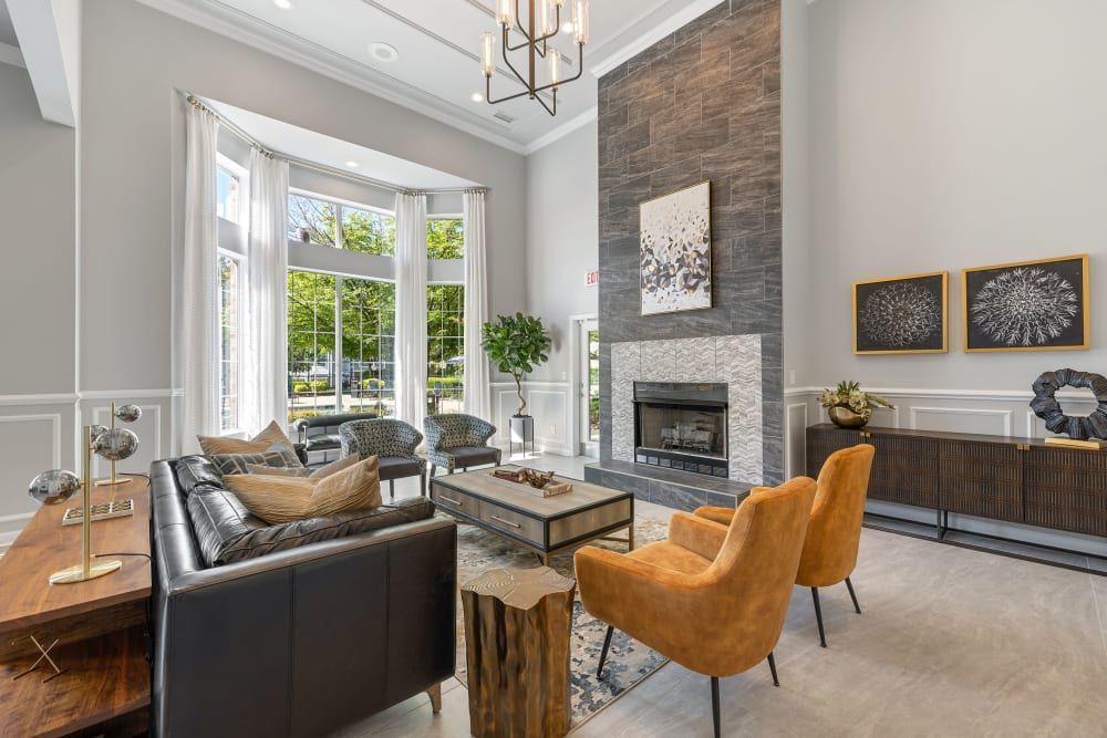 a living room filled with furniture and a fireplace at Marquis Carmel Valley in Charlotte, NC.