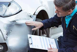 Mechanic Inspecting Car Damage - Auto Maintenance in Narragansett, RI