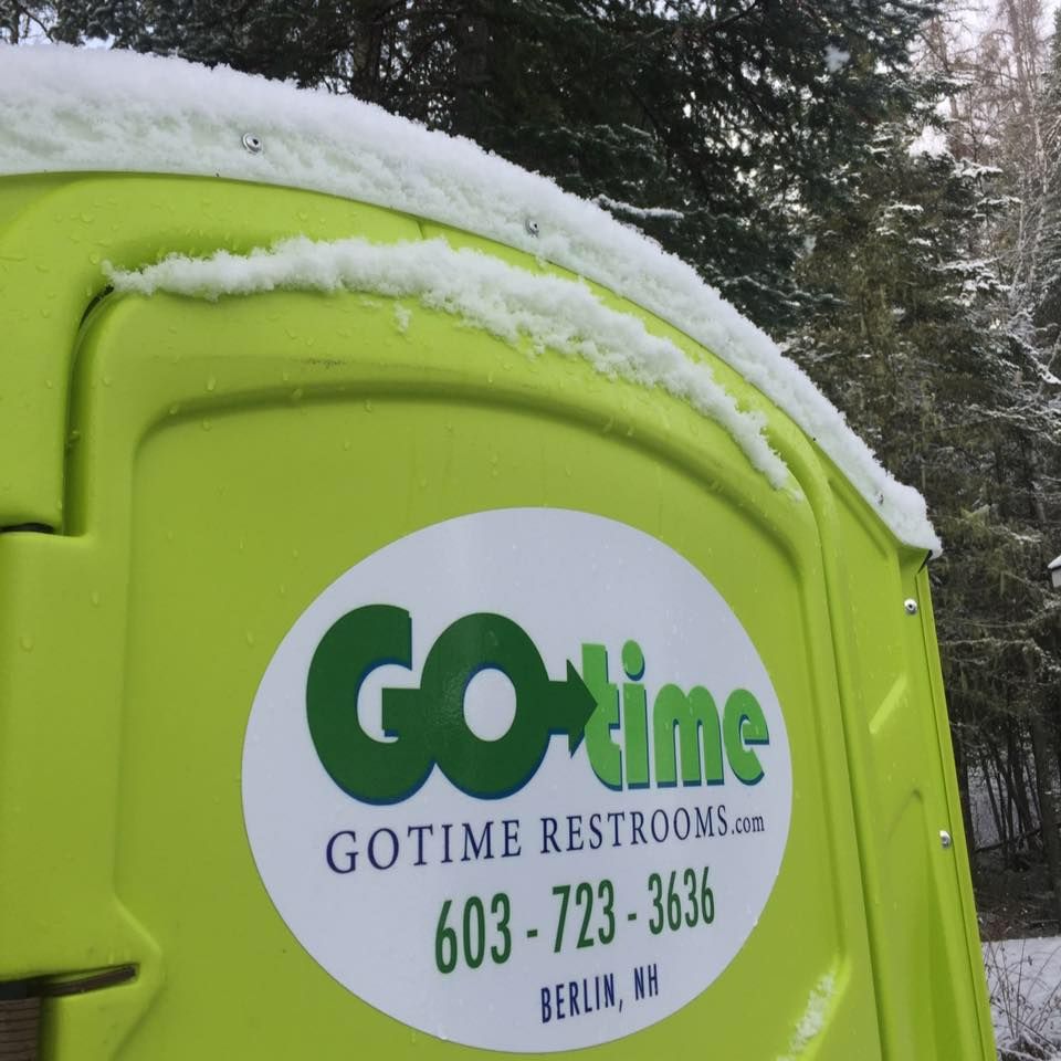 Lime green portable toilet with snow, logo 