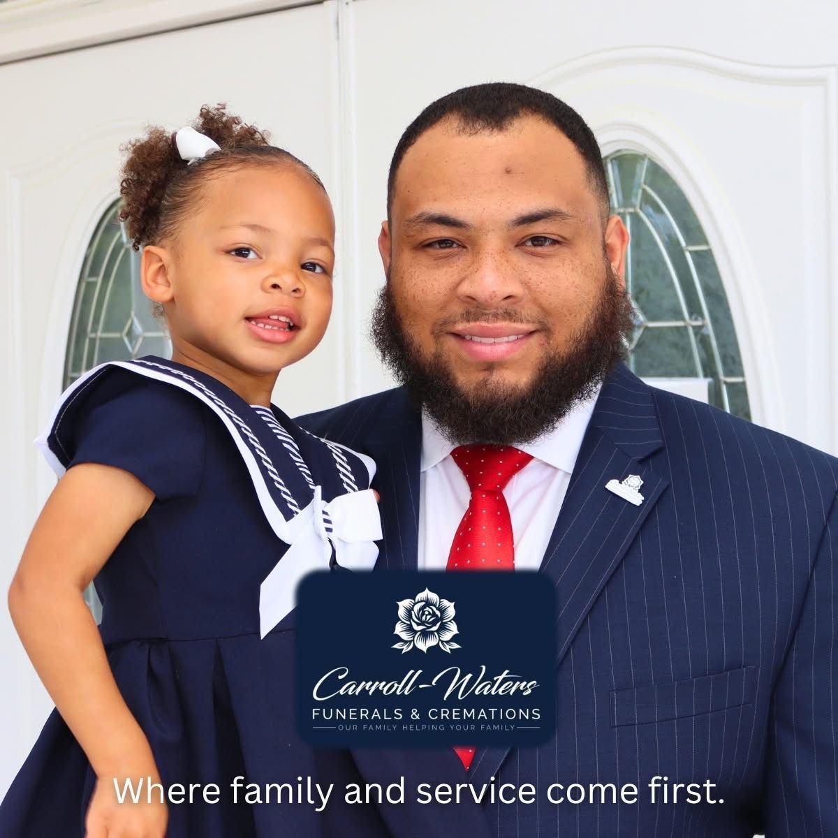 The front door of a house with a porch and plants in front of it.