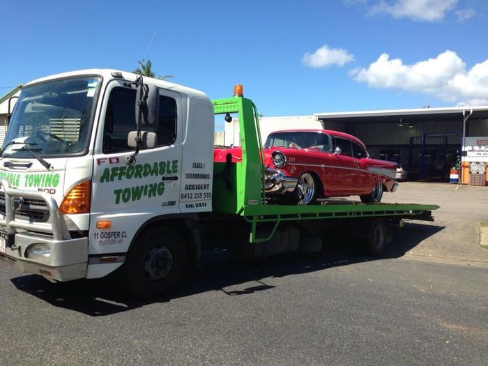 Affordable Towing Truck Carrying Red Classic Car - Towing Services in Mount Sheridan, QLD