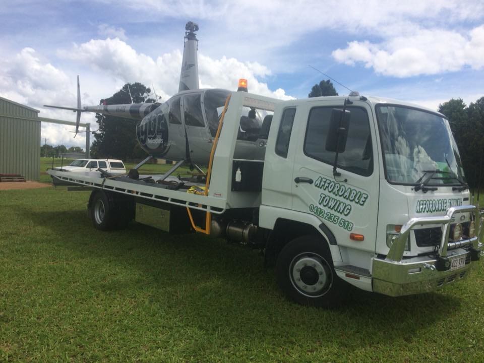 Tow Truck carrying Helicopter - Towing Services in Mount Sheridan, QLD