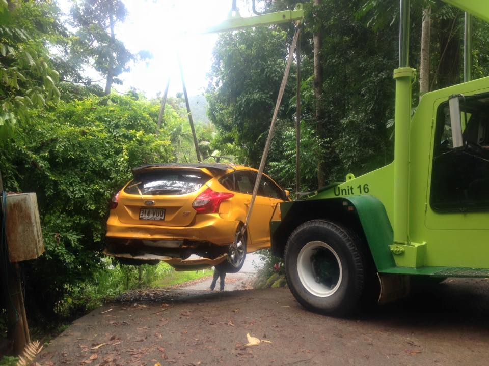 Yellow Car being Pulled onto Tow Truck - Towing Services in Mount Sheridan, QLD