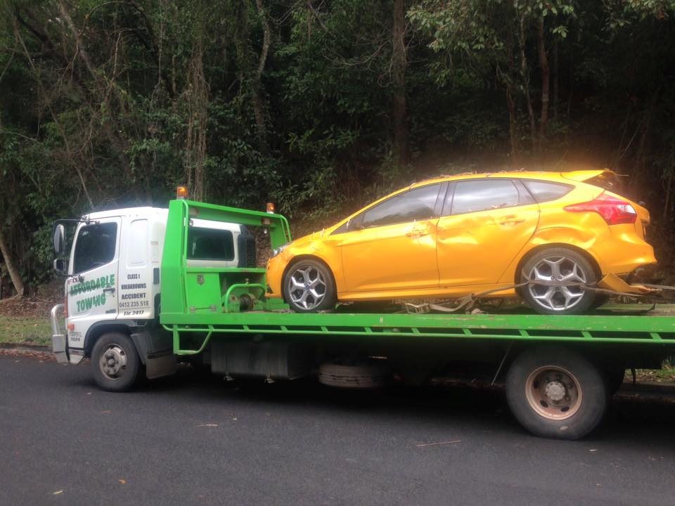 Yellow Car being Towed - Towing Services in Mount Sheridan, QLD