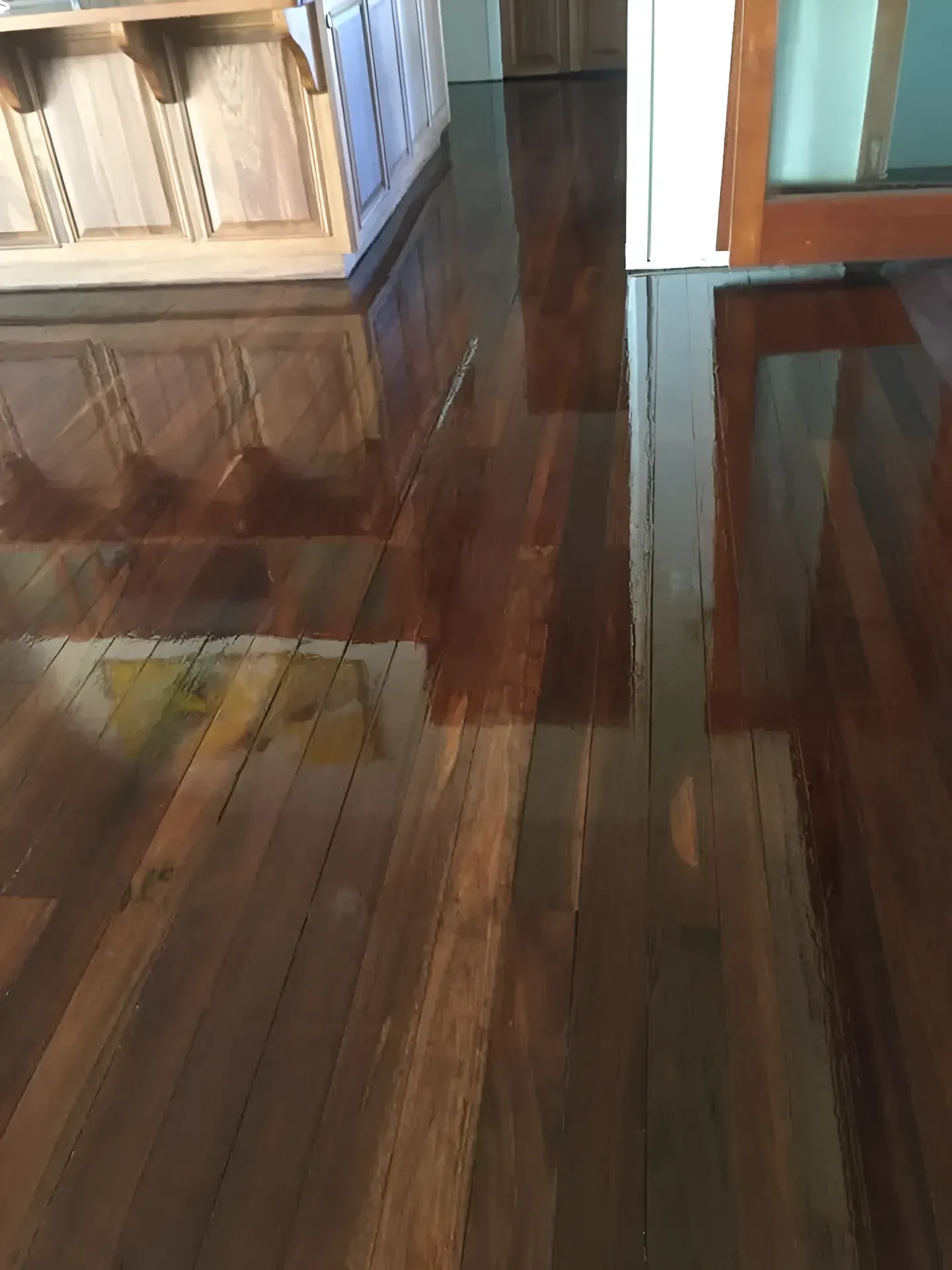 Reflective Wood Floor with Dark Red-Brown Planks — Toowoomba Polished Floors in Murphy's Creek, QLD