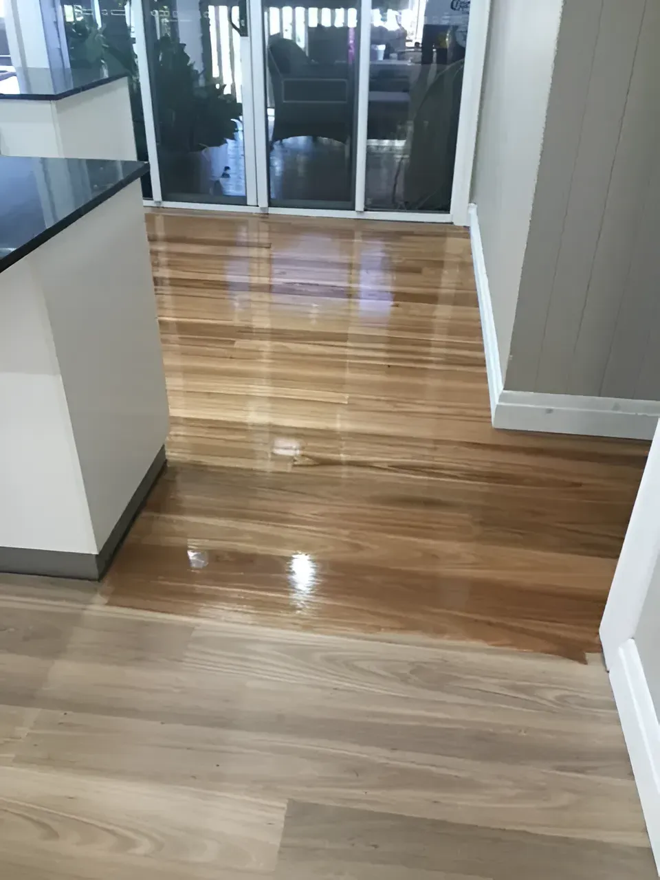 Wooden Floors with Dark Brown and Light Brown Tones in A Kitchen — Toowoomba Polished Floors in Dalby, QLD