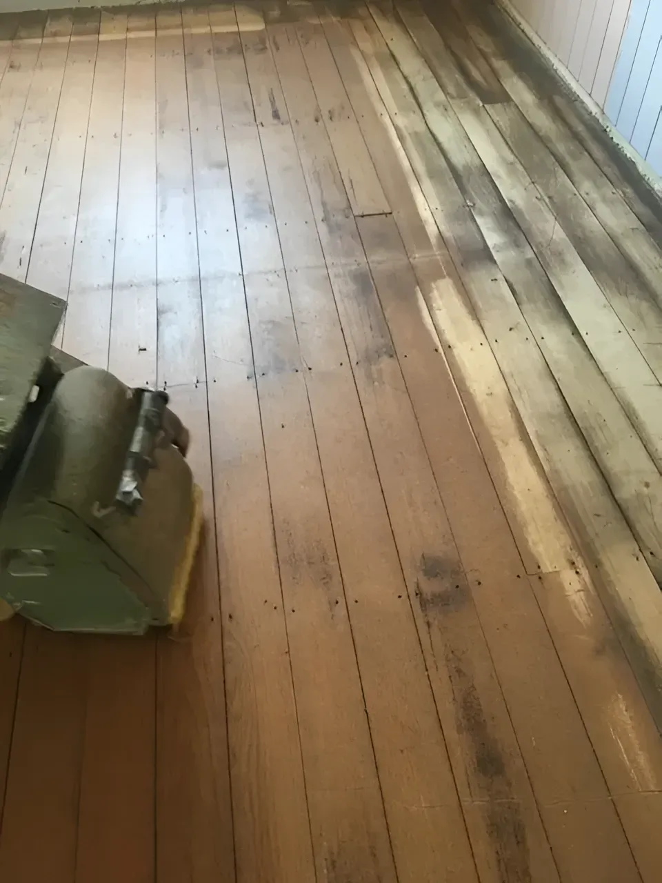 Floor Sander on A Wooden Floor Removing Old Stain — Toowoomba Polished Floors in Toowoomba, QLD