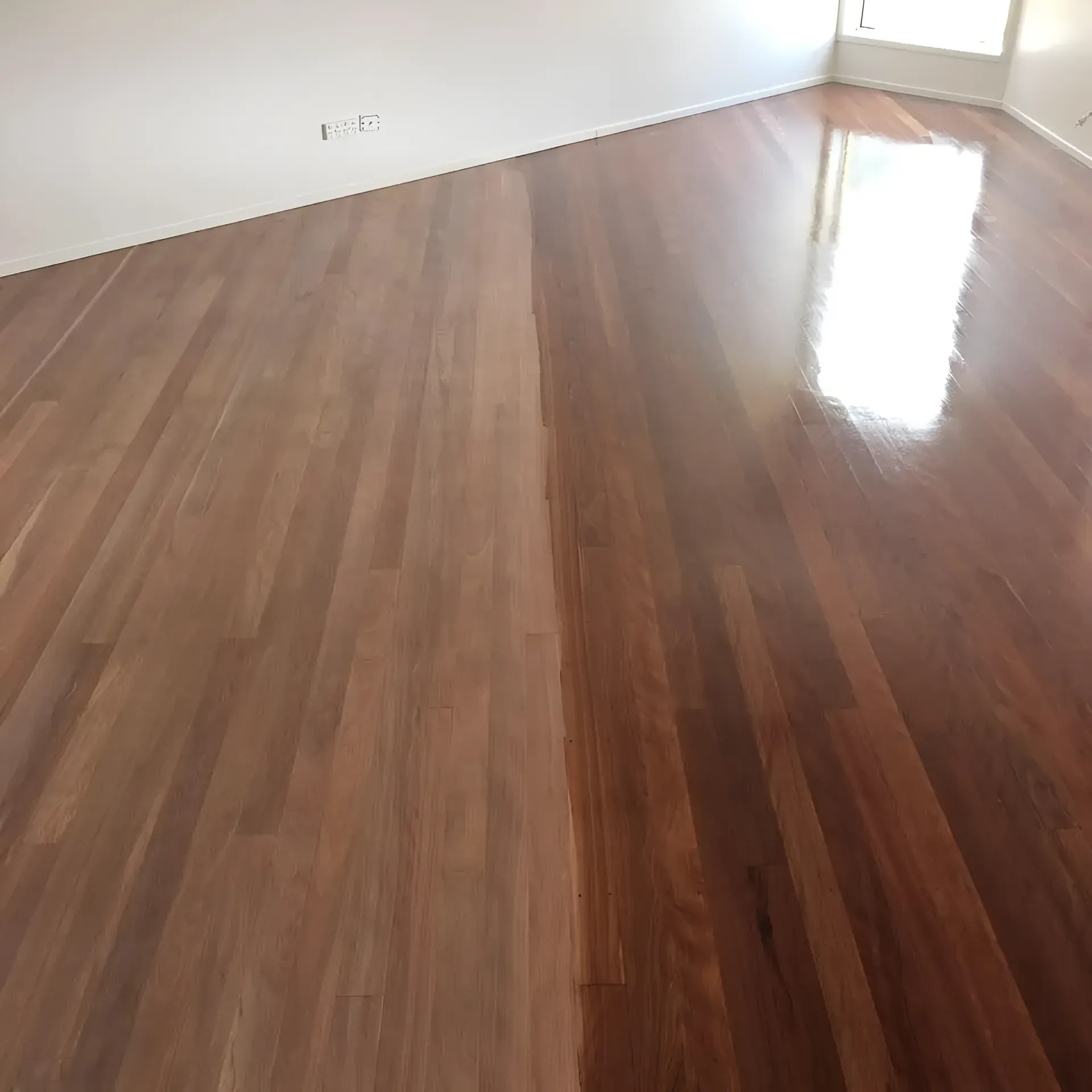 Half-Finished Wood Floor with A Shiny Dark Finish on The Right — Toowoomba Polished Floors in Pittsworth, QLD