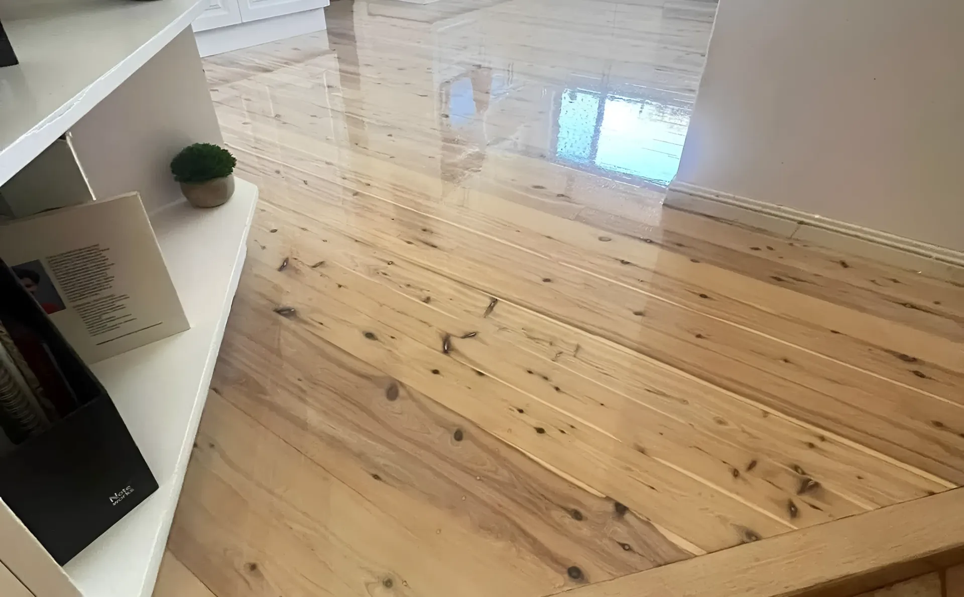 Shiny Light-Colored Wooden Floor with A Glossy Finish — Toowoomba Polished Floors in Highfields, QLD