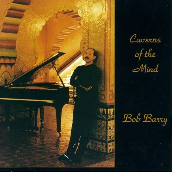 Bob Barry standing next to a piano on the album cover caverns of the mind