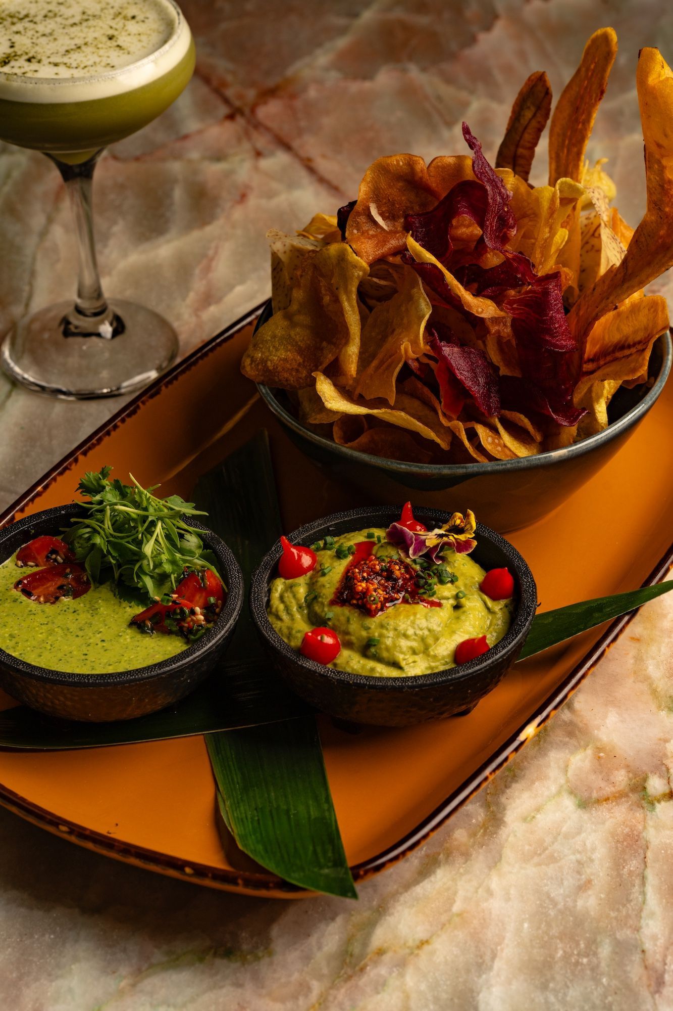 Guacamole and green salsa with side of chips