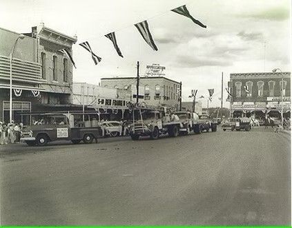 A black and white photo of a city street in 1977