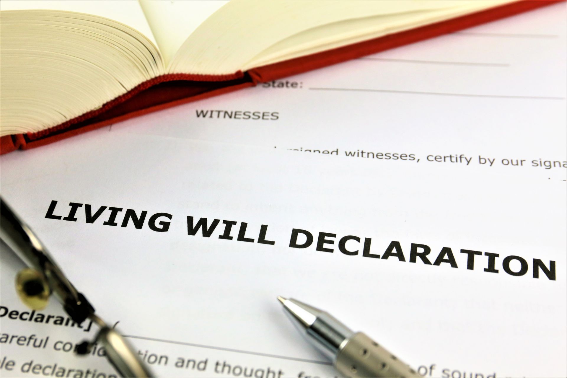 A living will declaration with a pen and a book