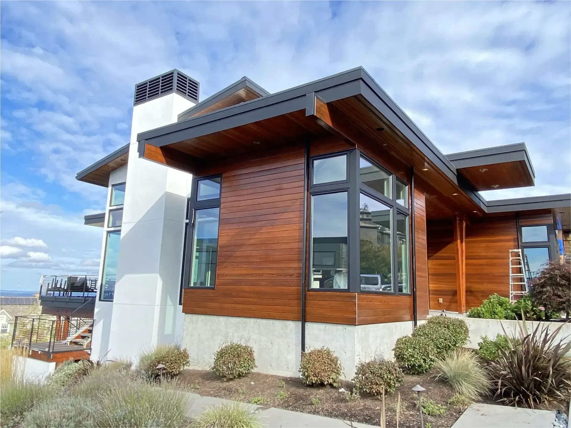 A large house with a lot of windows and a chimney