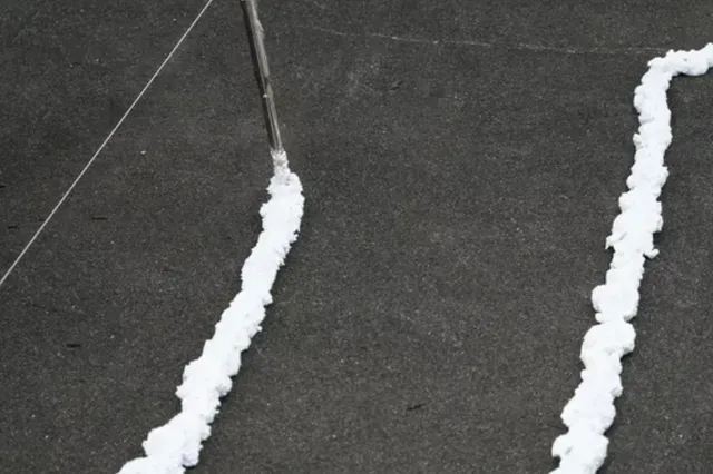 An image showcasing the installation process of a gutter guard system.
