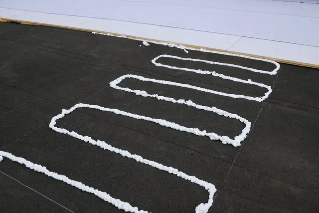 A gutter guard installed on a residential roof.