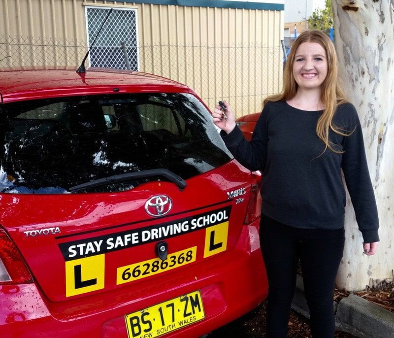 Woman and Red Car — Driving School in Wollongbar, NSW
