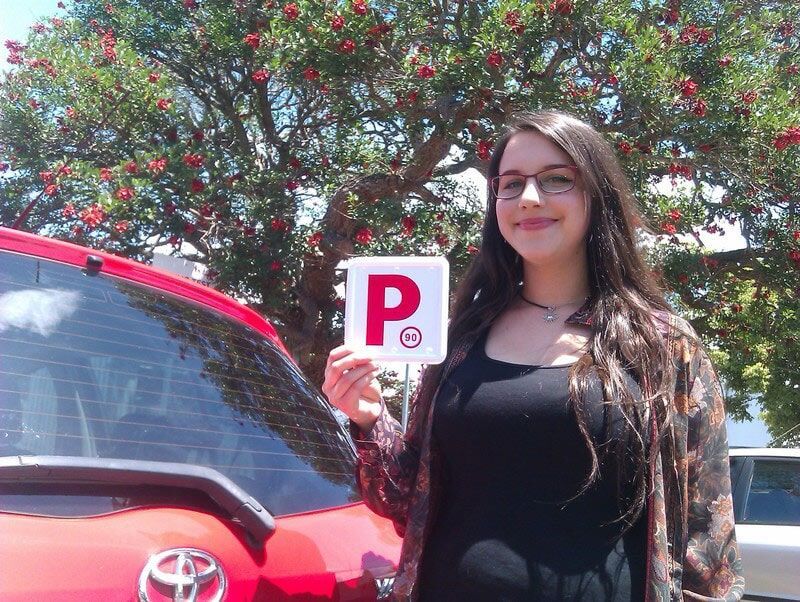 Woman Handling Card — Driving School in Wollongbar, NSW