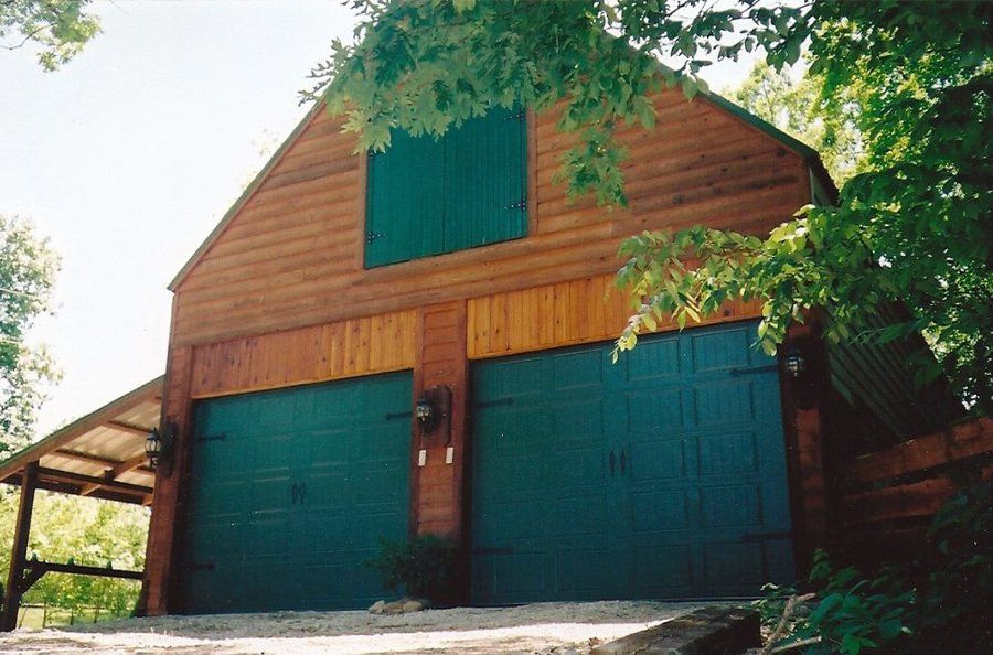 Give Your Mid-Missouri Farmhouse a Pop of Color With Green Doors From Glenn’s Garage Doors!