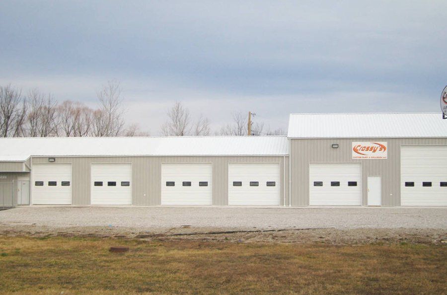 A Garage Door for Crossy’s Custom Paint & Collision By Glenn’s Garage Doors in Moberly, MO.