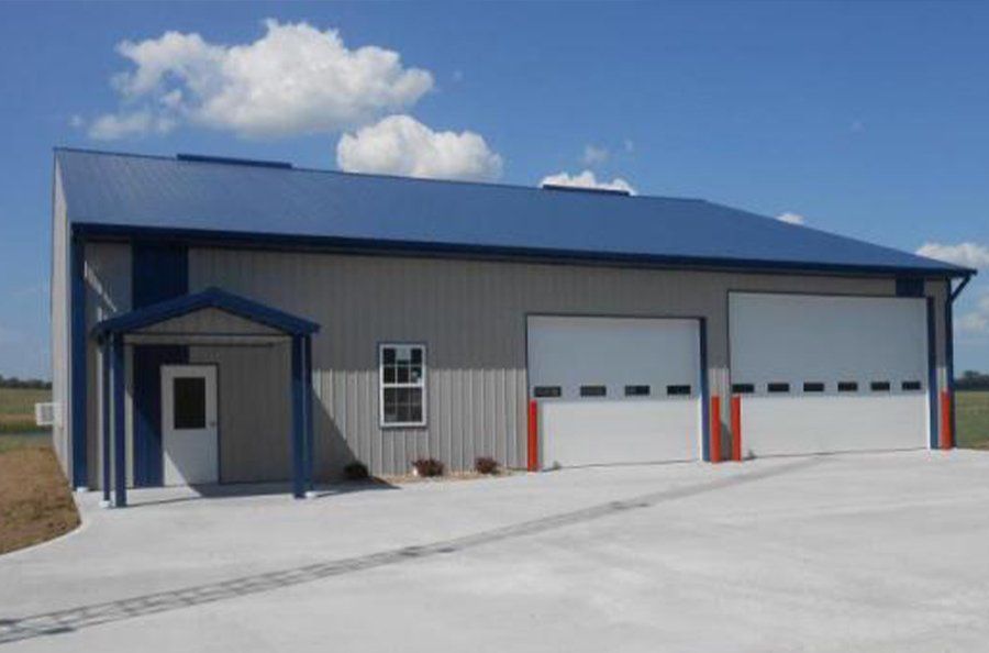 A Commercial Garage With Blue Lining, Garage Doors by Glenn’s Garage Doors in Mid-MO.