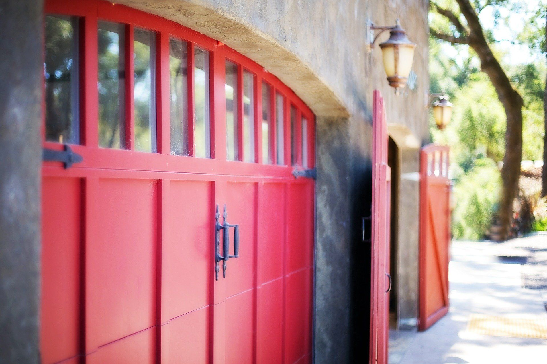 A Beautiful Red Farm Garage Door. Want One for Your Mid-MO Home? Call Glenn’s Garage Doors!