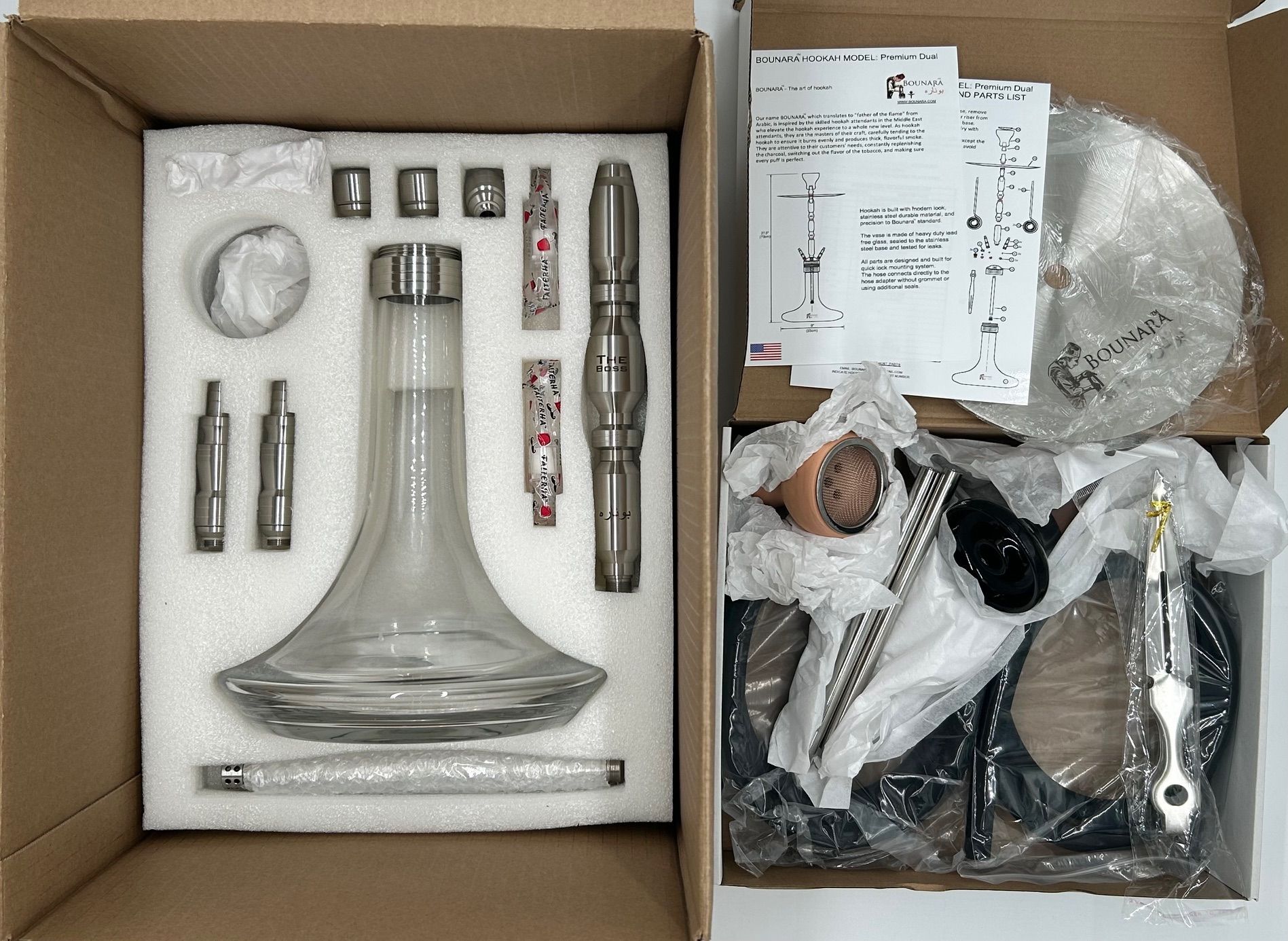 Hookah with peach bowl, silver tray, clear base, and black hoses on a white background