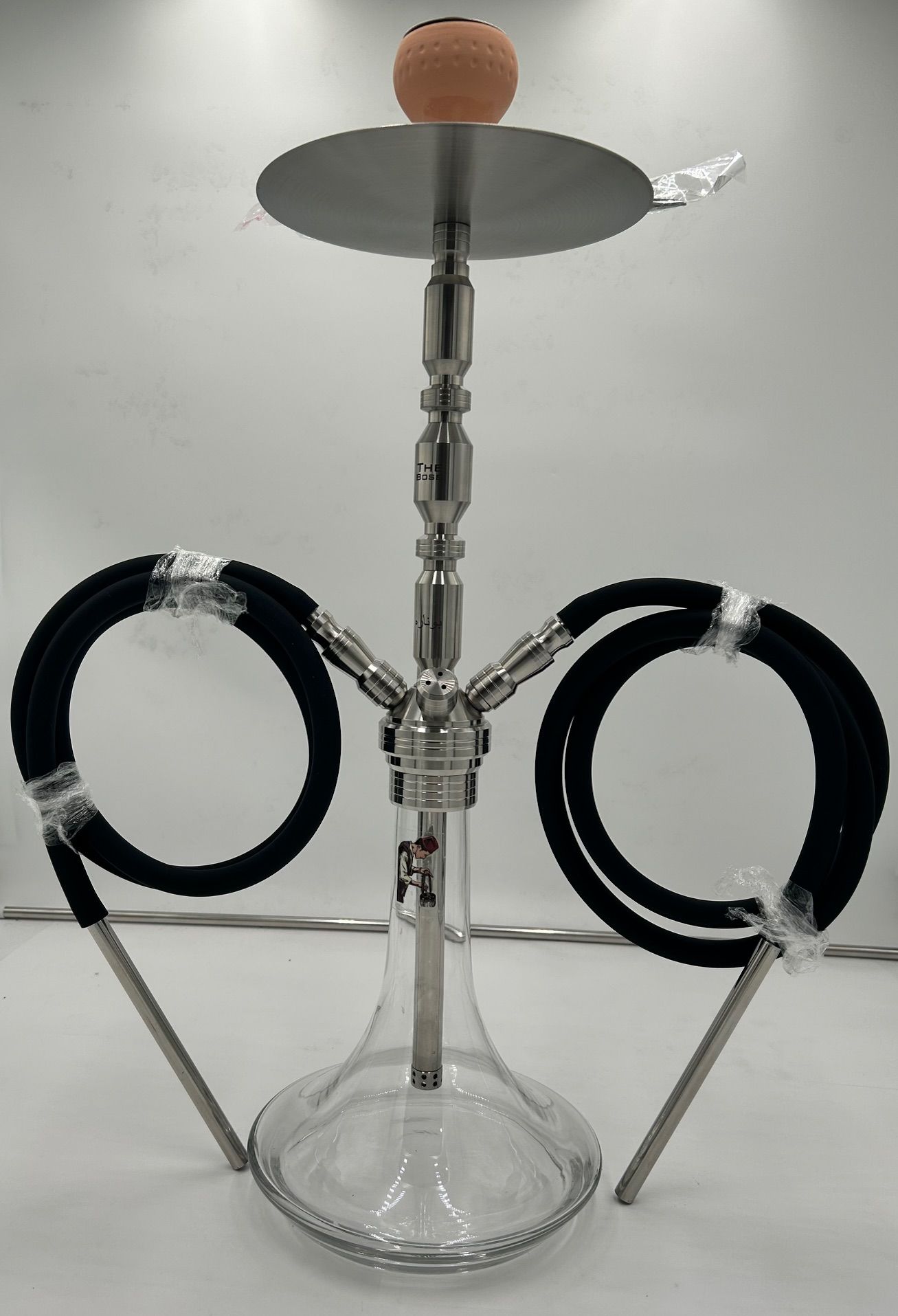 Stainless steel hookah with clear glass base, two black hoses, and a top bowl.