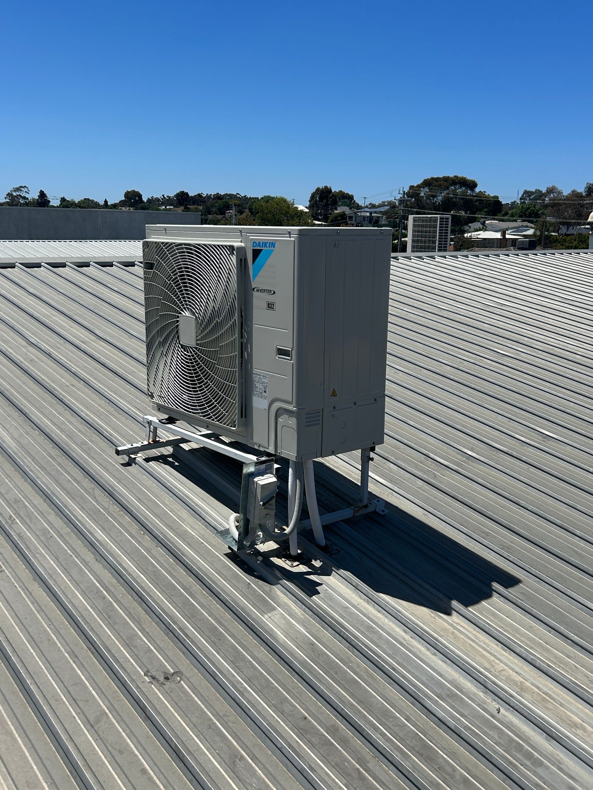 Air Conditioner On Top Of A Metal Roof — Bendigo, VIC — Evolve Heating and Cooling