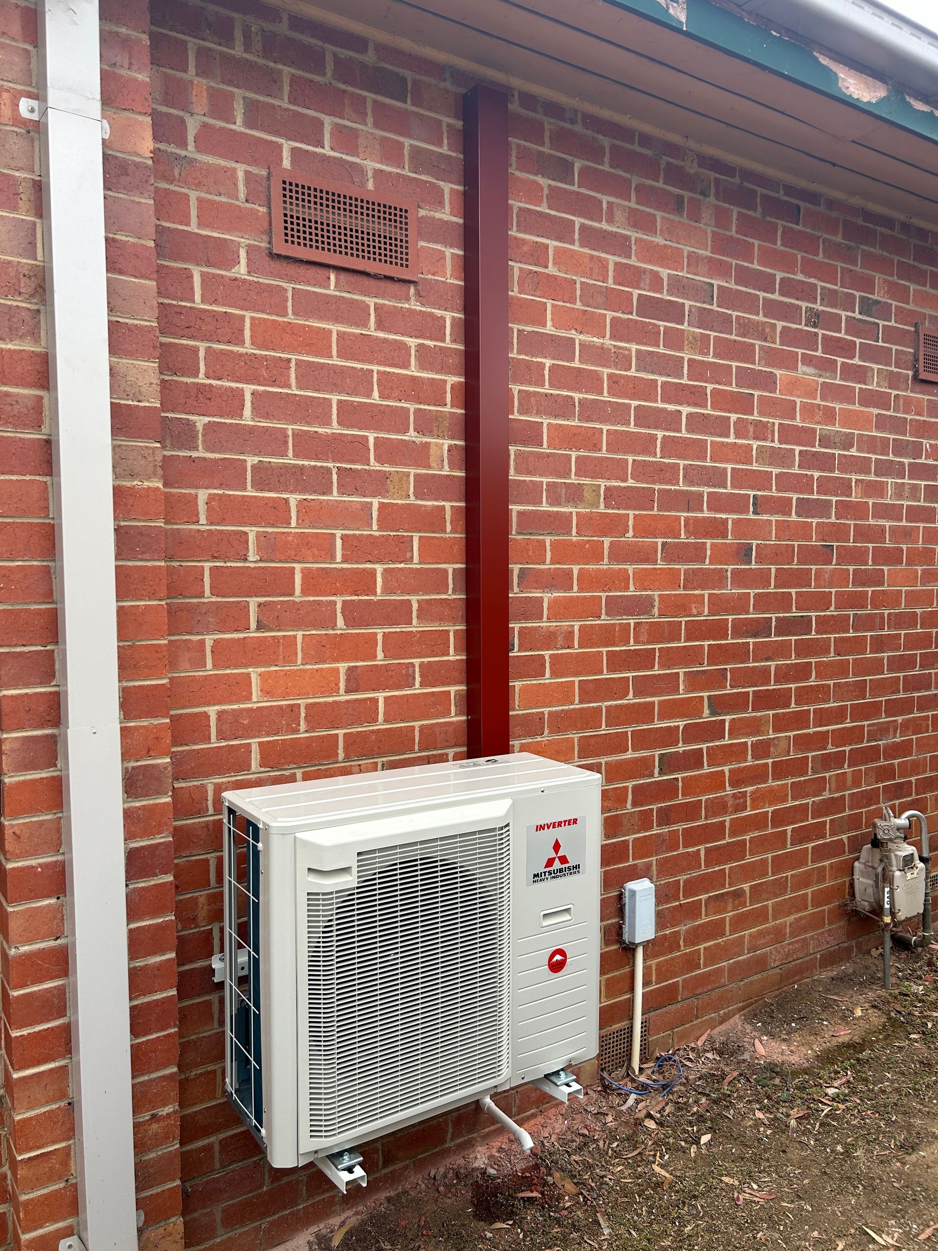 Air Conditioner On A Brick Wall — Bendigo, VIC — Evolve Heating and Cooling