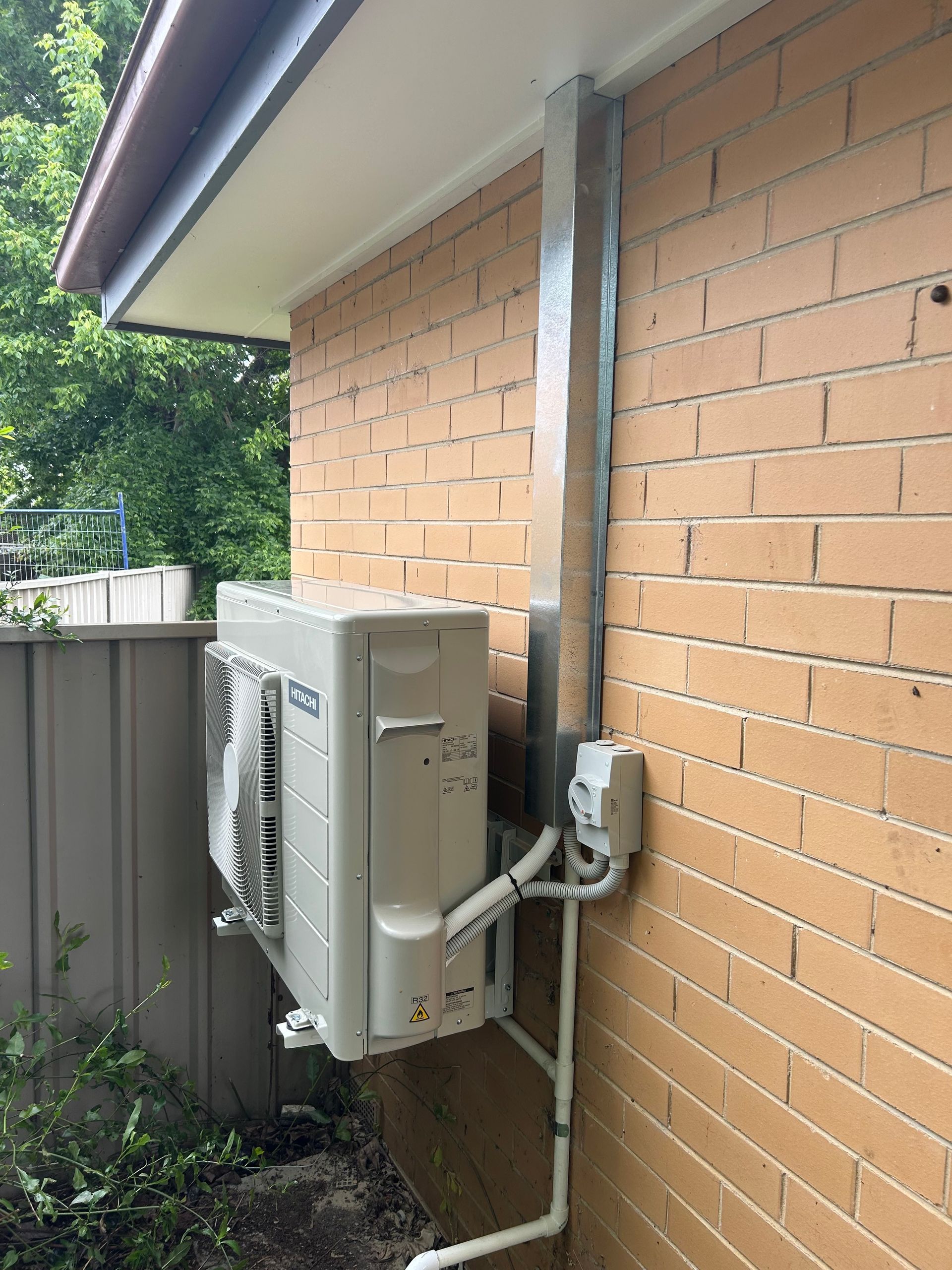 Upgrade AC Unit Mounted On Brick Wall — Bendigo, VIC — Evolve Heating and Cooling