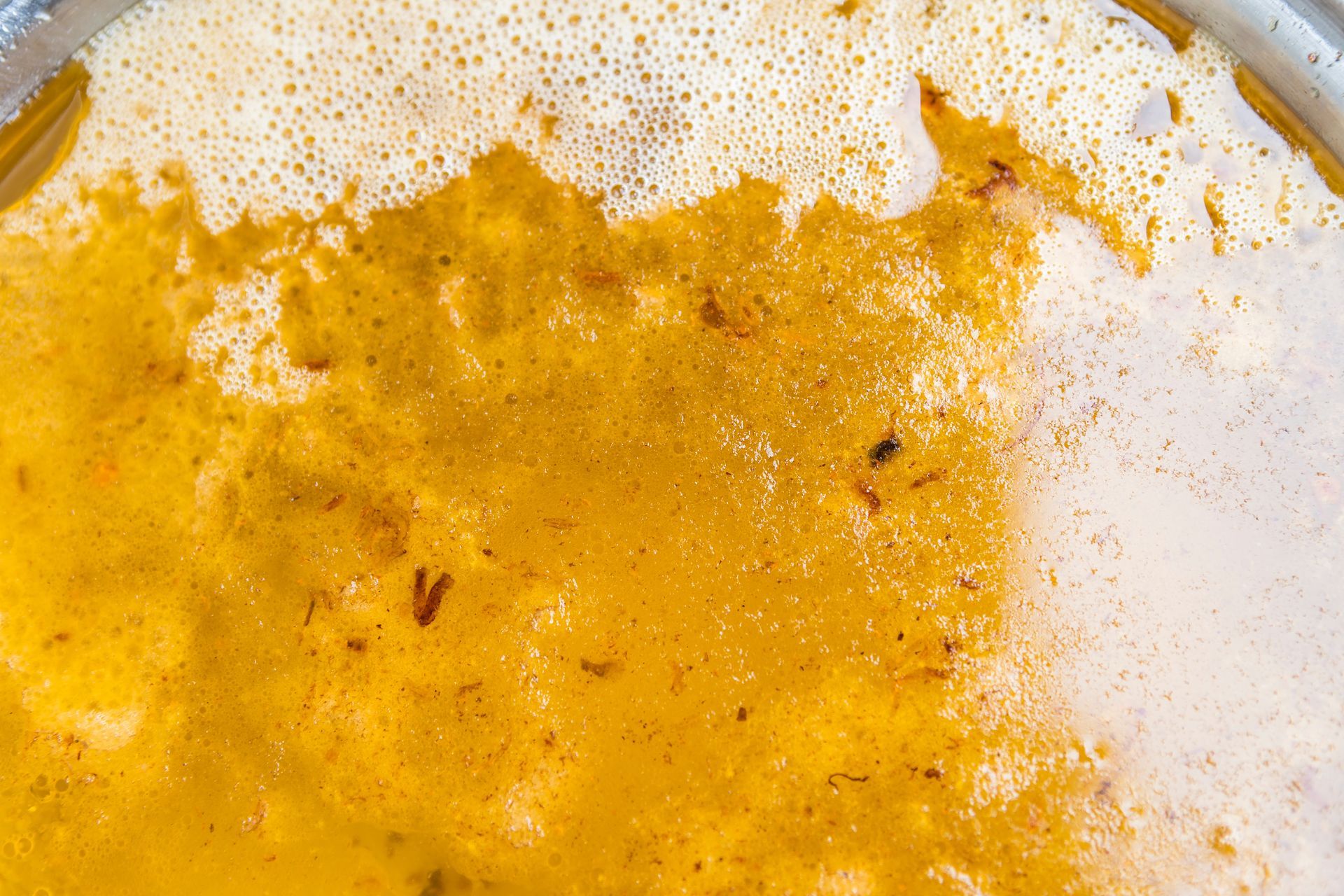 Closeup old cooking oil with dishwashing liquid.