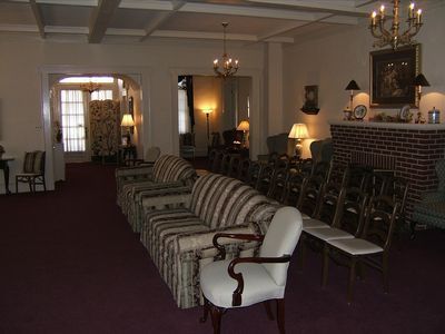 A church with rows of wooden benches and a podium
