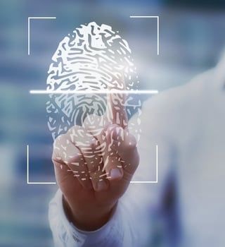 A person is holding a fingerprint in front of a screen | Arlington, TX | Prolific Fingerprinting and
