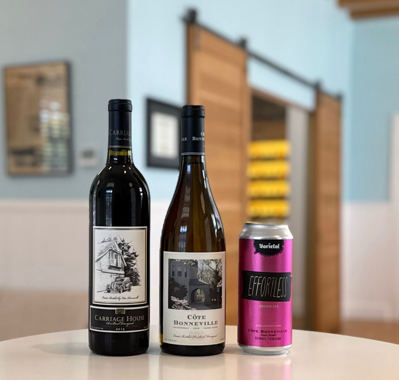 An image of red wine, white wine, and a beer can