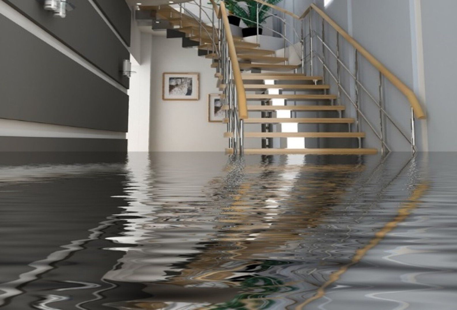 A flooded hallway with stairs and water on the floor
