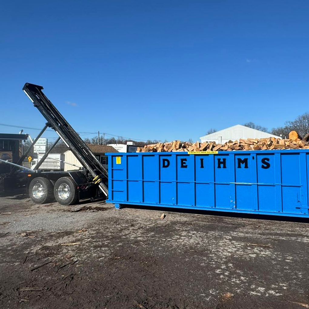 A row of garbage trucks from Deihm's Disposal of PA