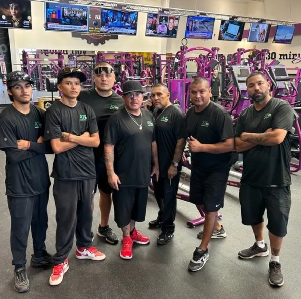 A man is carrying a box up a set of stairs.