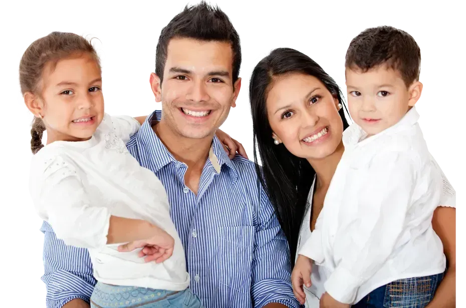 a family is posing for a picture together and smiling for the camera .