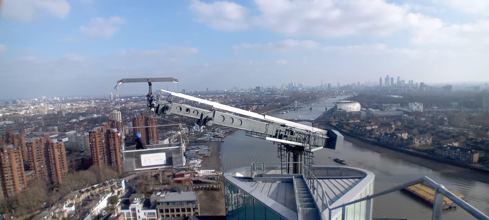 Zarafa Building Maintenance Unit extended over building with the Thames and London in the background
