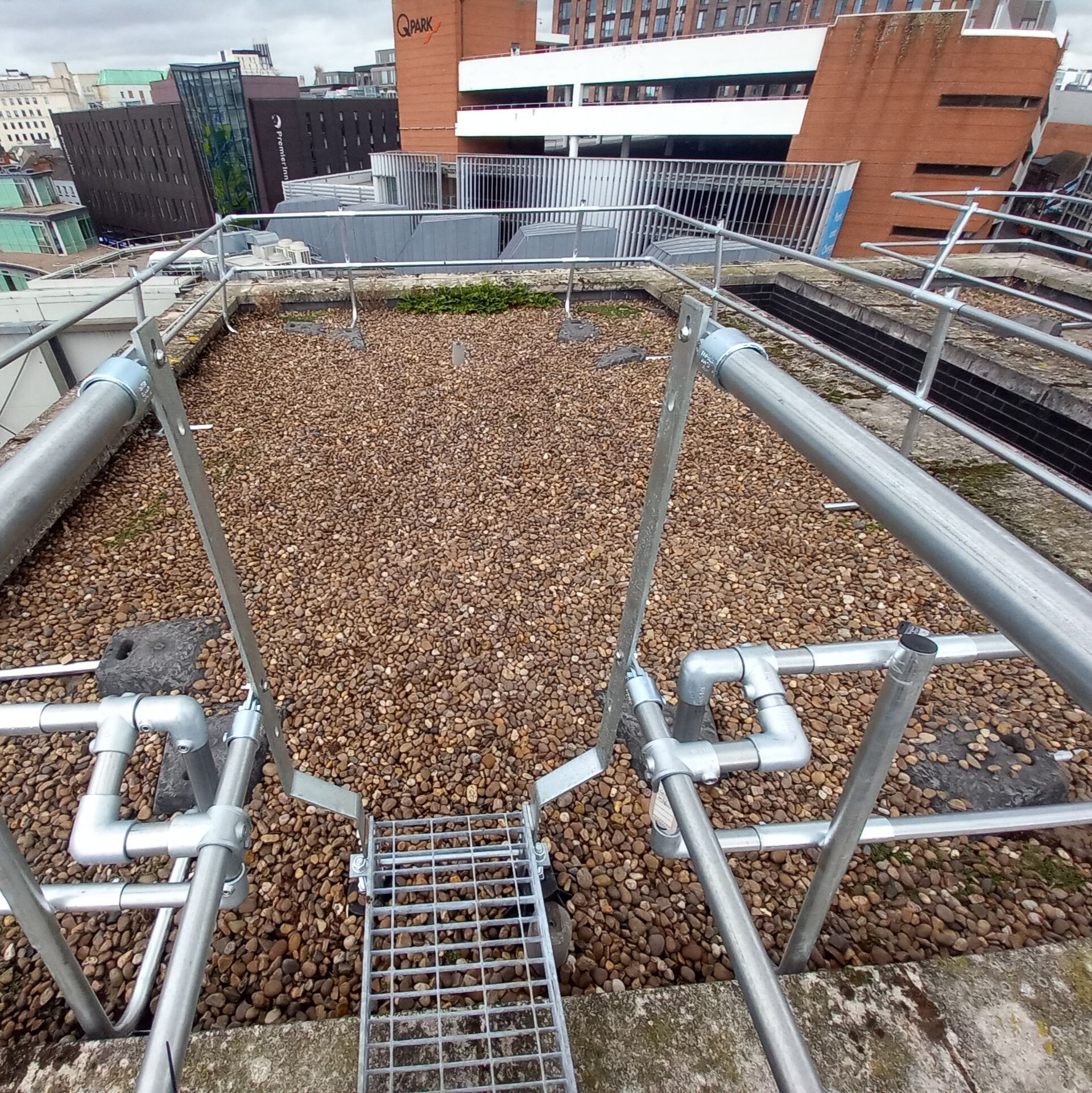 Zarafa replaced mansafe system with guardrail and ladders for collection protection on shopping centre