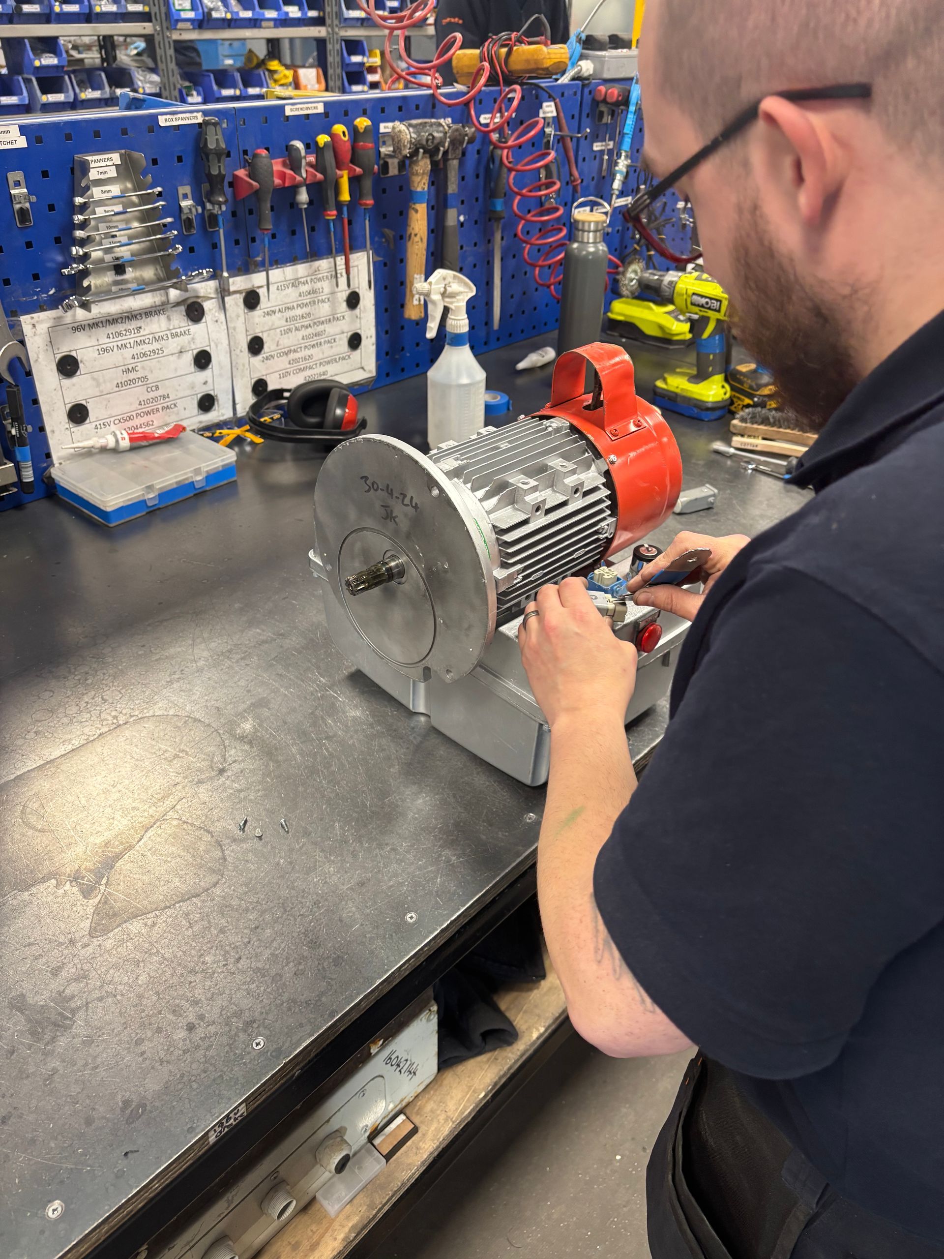 Engineer working on a man riding hoist used in a wind turbine service lift