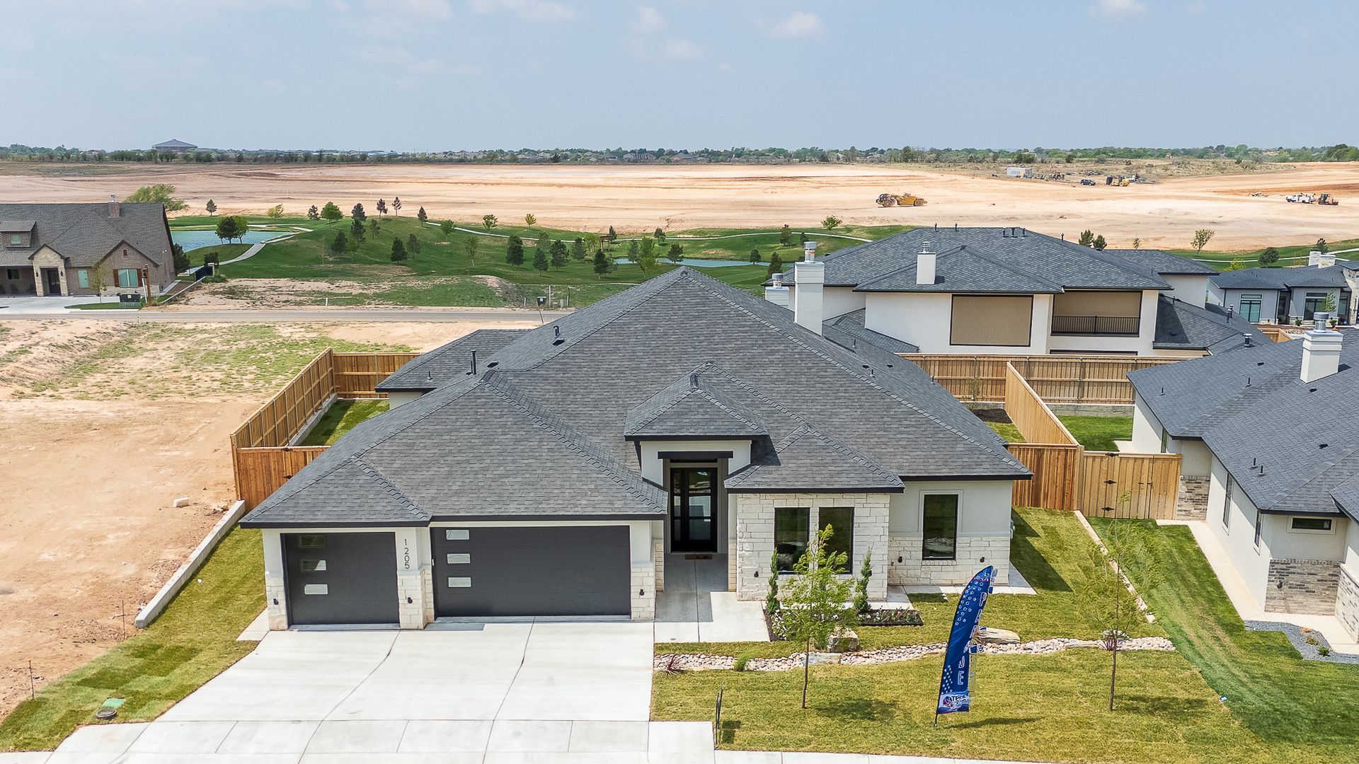 An aerial view of a house in a residential area
