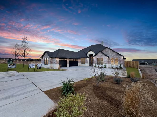 A large house with a lot of windows is for sale.