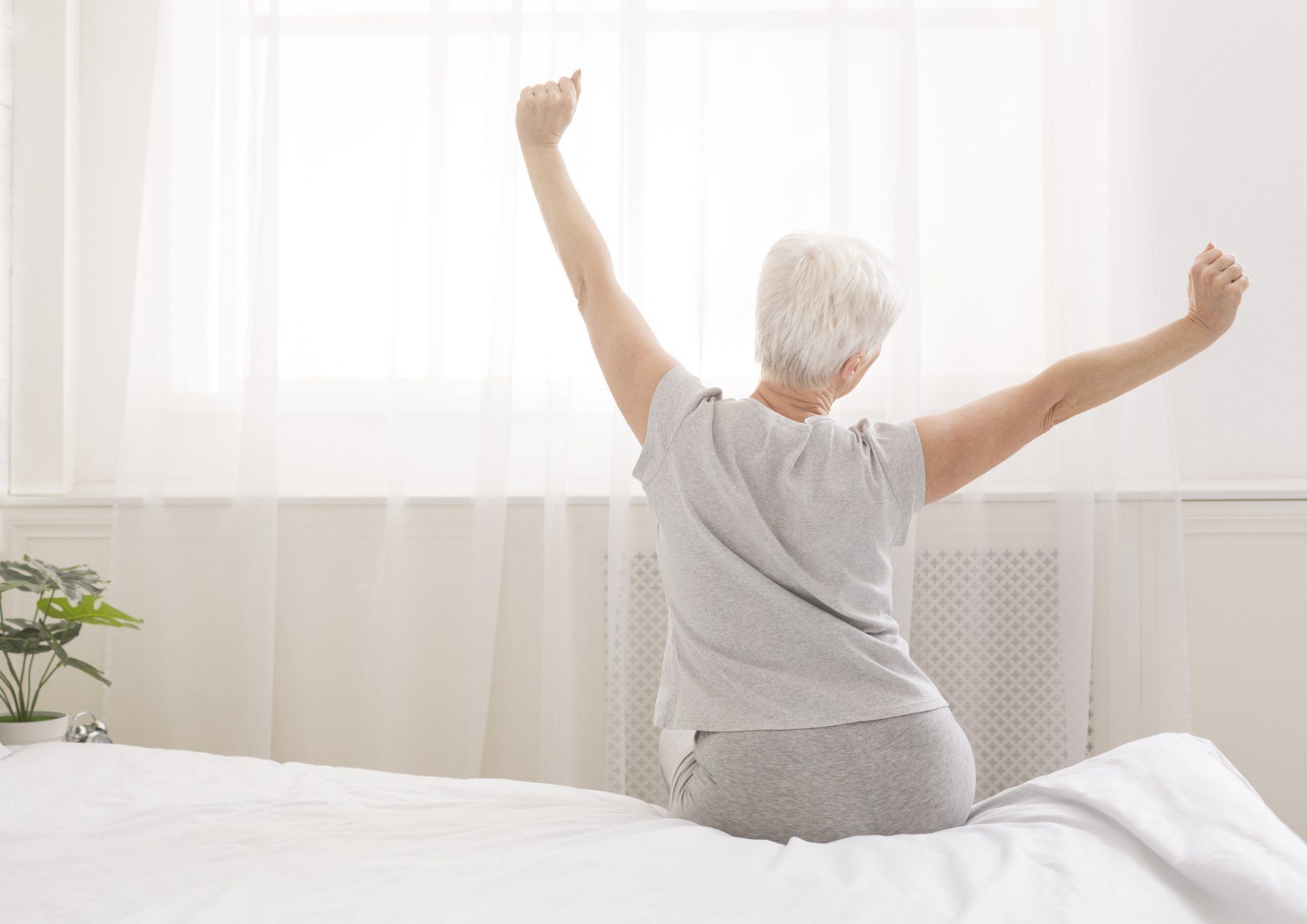 Old Woman Stretching | Coastal Neurology, Inc. | Daytona Beach