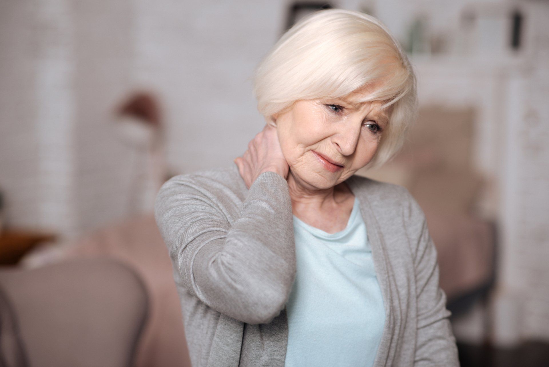 Senior Woman Having Neck Pain | Coastal Neurology, Inc. | Daytona Beach