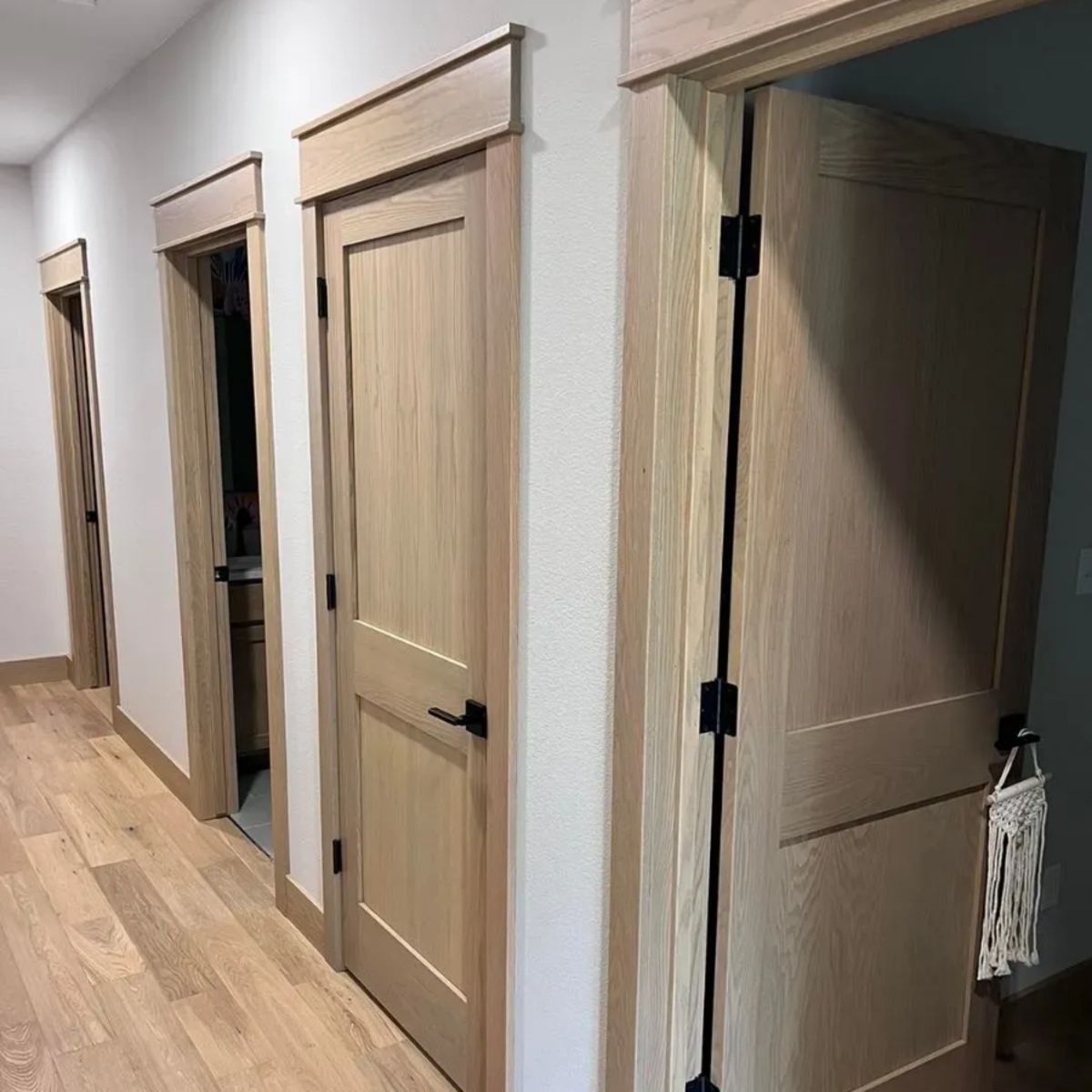 Custom solid wood interior door with natural stain finish installed in a Kansas City home