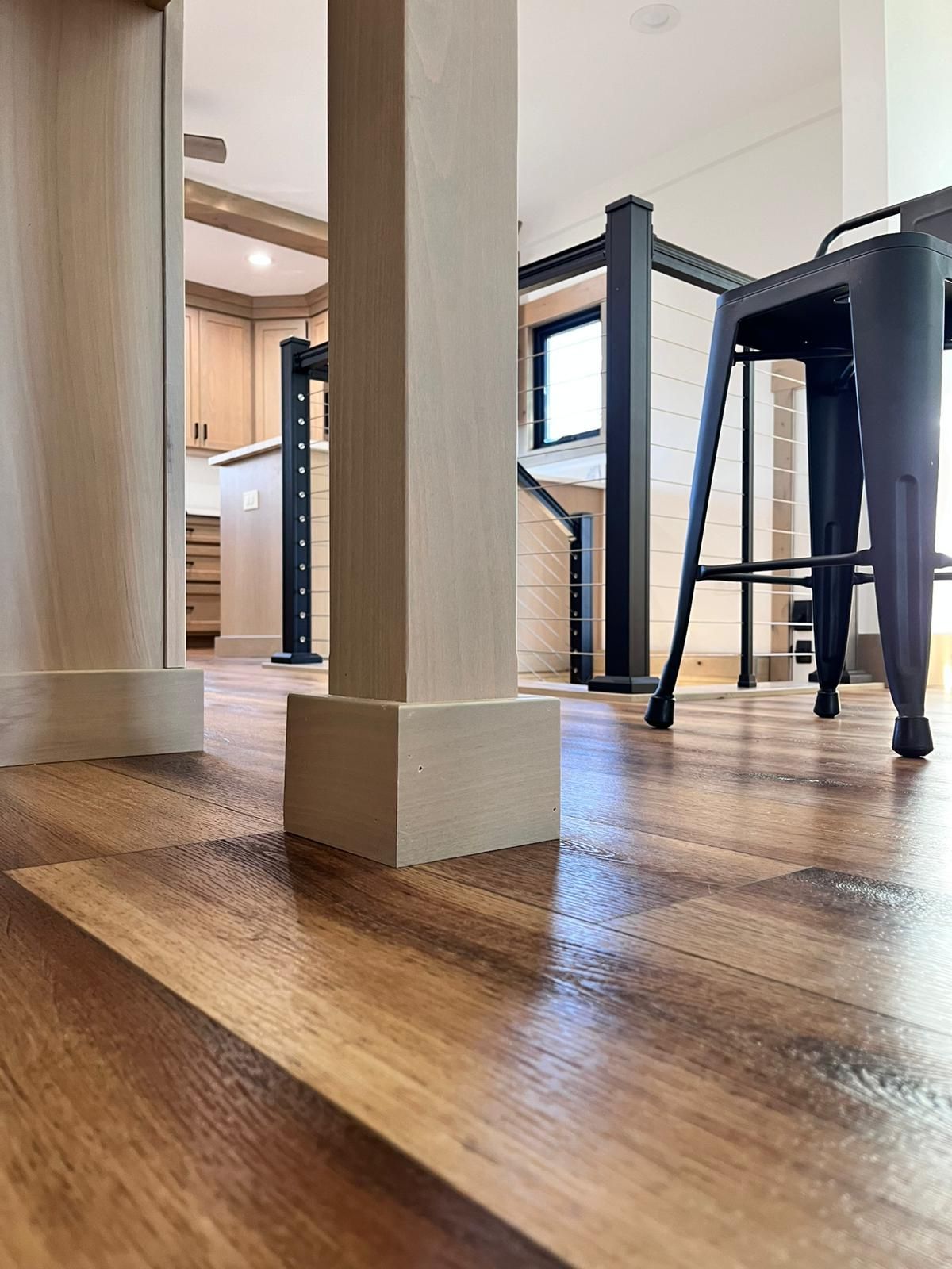A wooden door in a room with a white wall