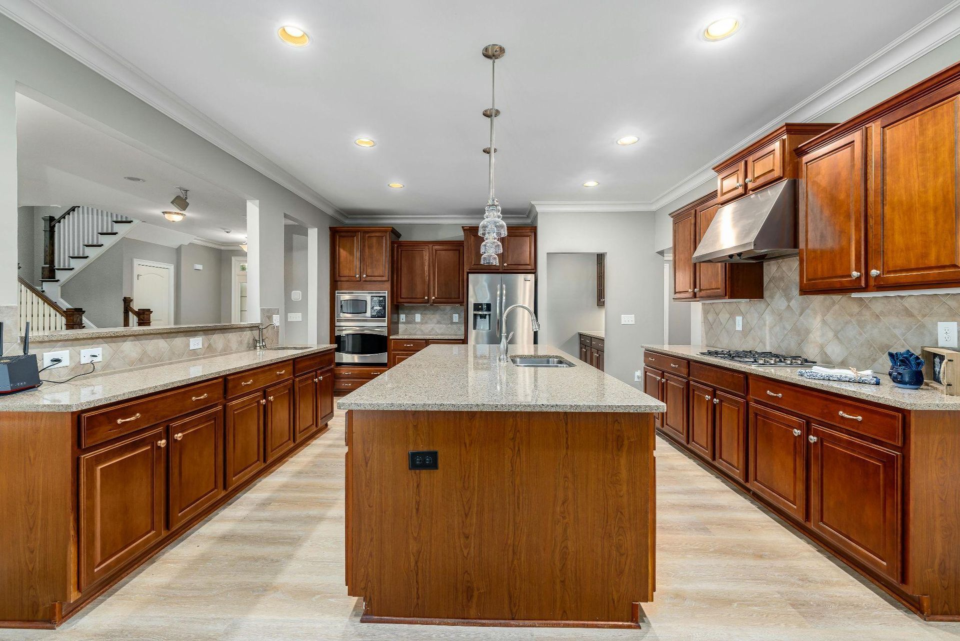 Custom wood kitchen island and cabinets in a bright, open kitchen
